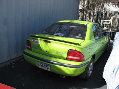 It's a 1995 Plymouth Neon Sport Coupe in that particularly awesome factory 